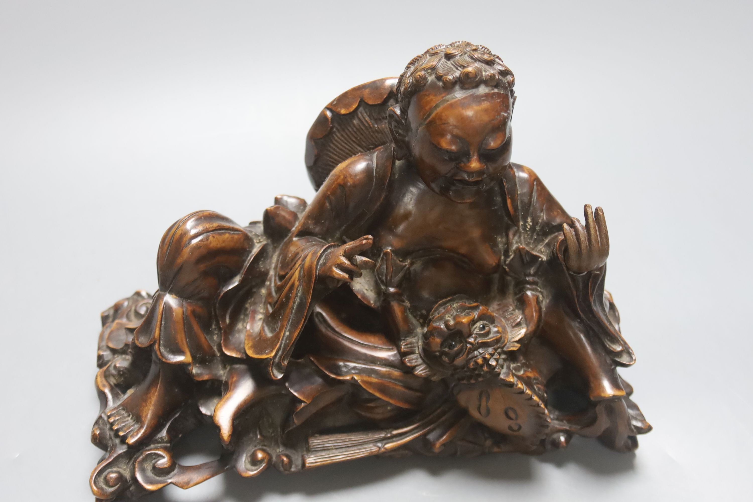 A Chinese hardwood group of Liu Hai and his three legged toad, 23cm